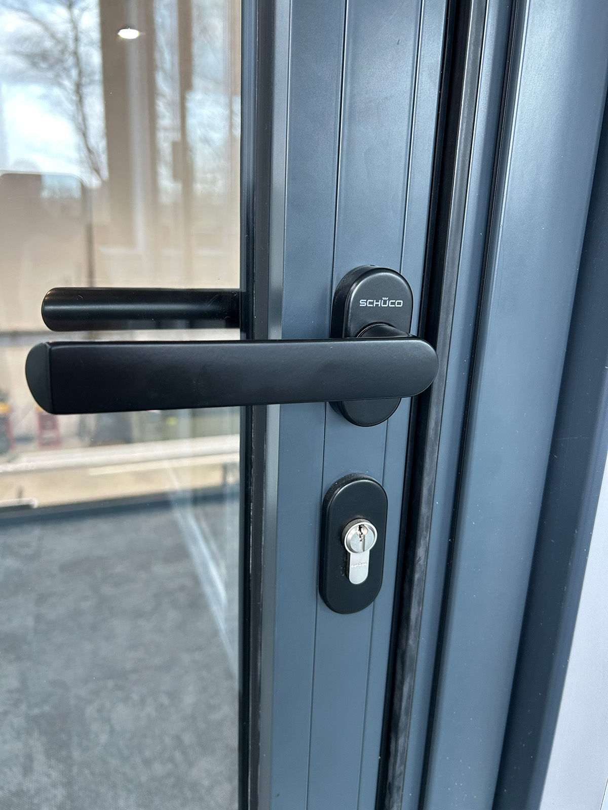 Secure bifold door handle